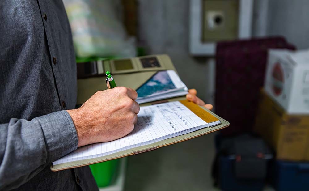 Man doing home inspection to help finance mortgage