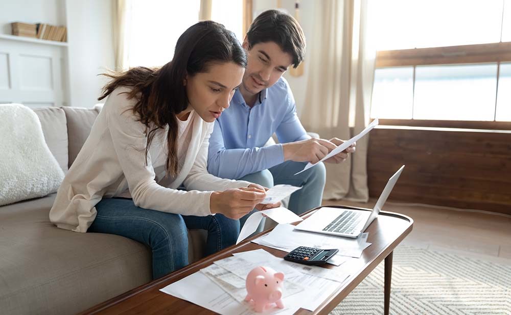 couple reading the Mortgage Loan Income Requirements